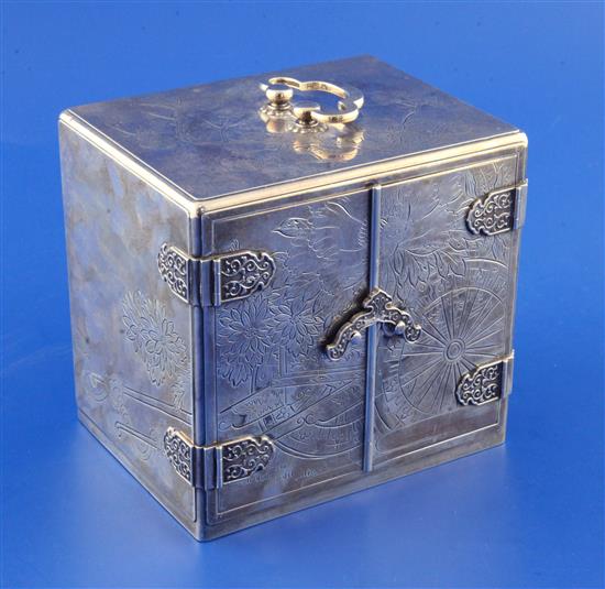 A mid 20th century Japanese sterling silver mounted ebonised two door trinket cabinet, 5in.